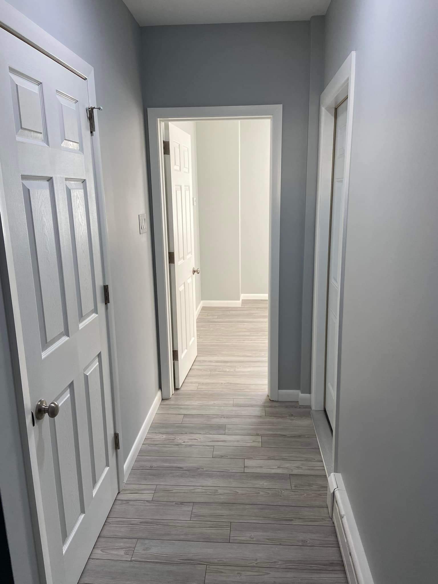 Finished hallway — new flooring and decorated walls